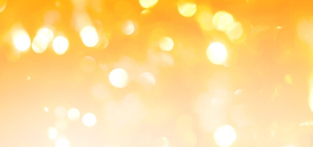 Golden gradient background with bokeh effect for modern, minimal web design